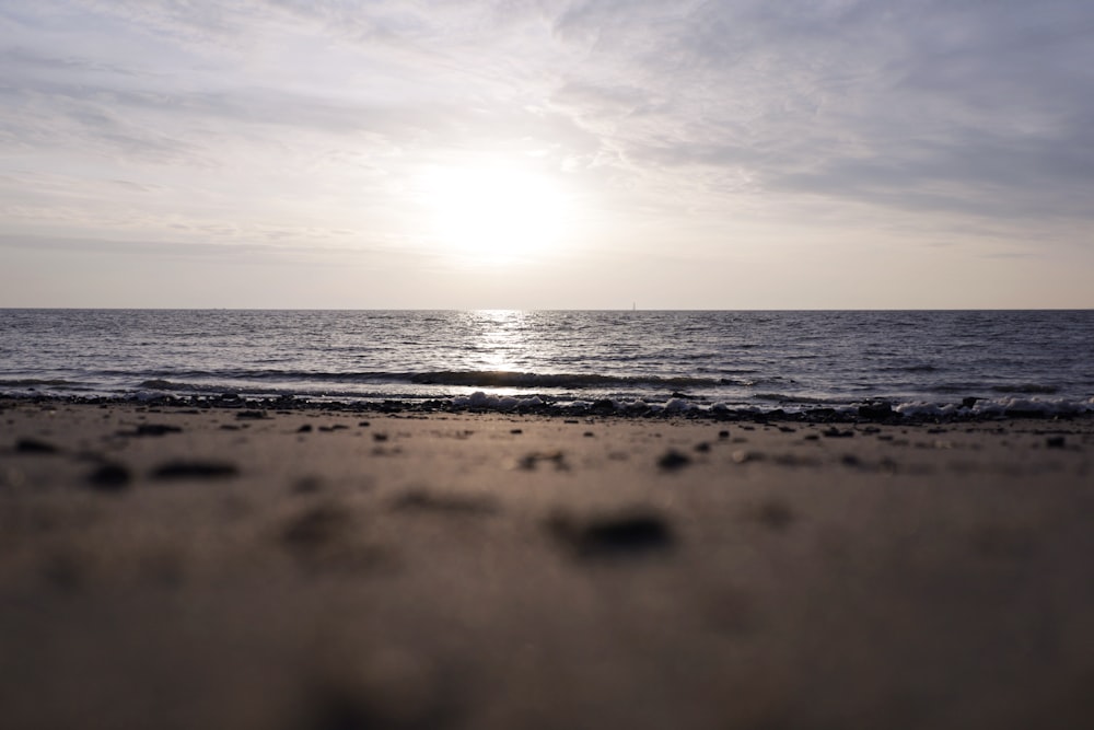 body of water under cloudy sky during daytime