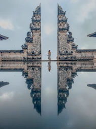 gray concrete cross on top of gray concrete building
