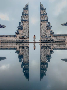 gray concrete cross on top of gray concrete building