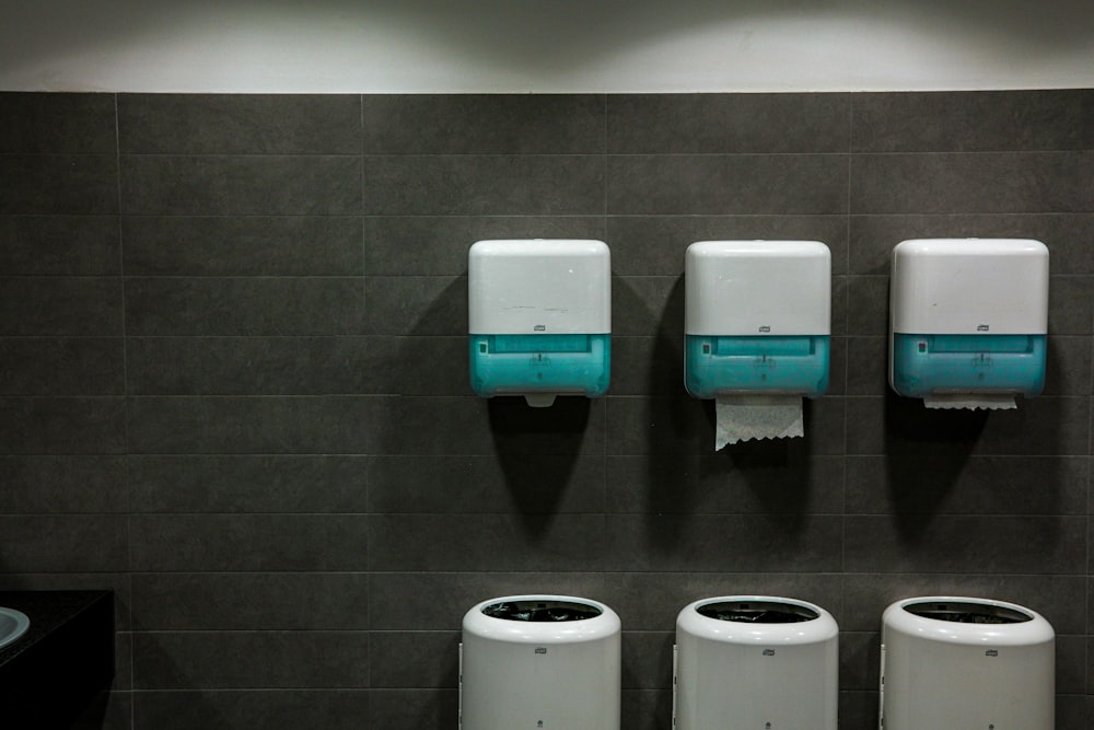 white toilet paper roll on white toilet paper holder