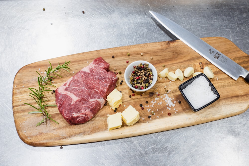 sliced meat on brown wooden chopping board