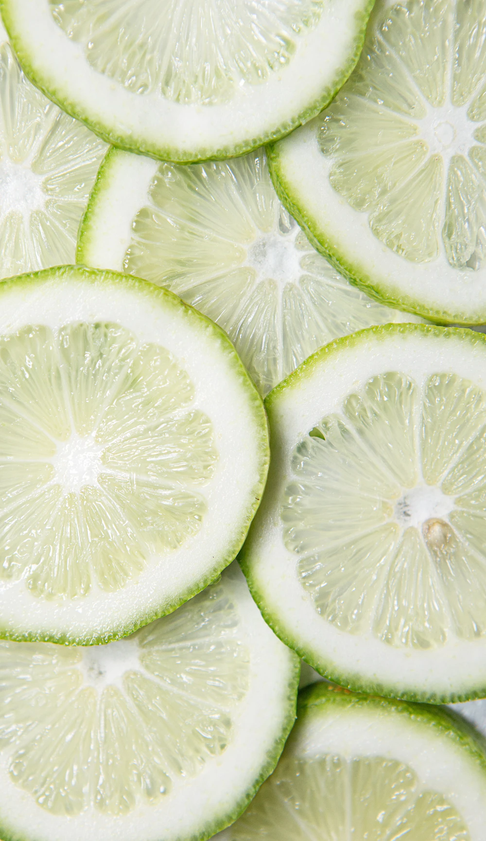 Sliced limes on a wooden table