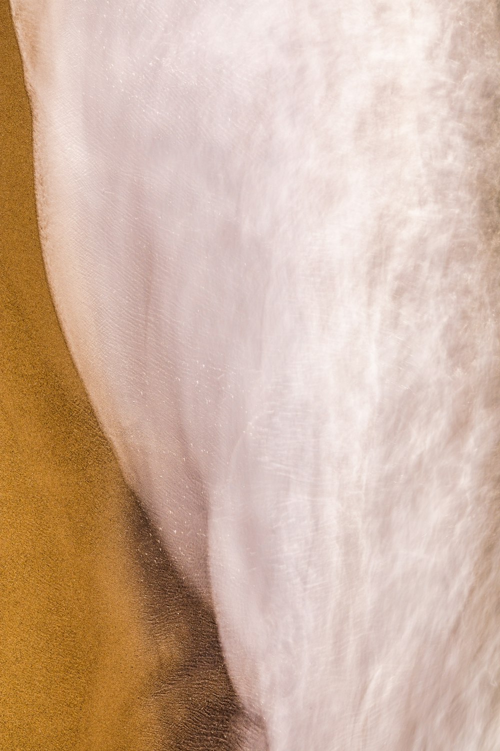 white textile on brown textile