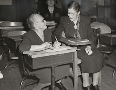 man and woman sitting on chair
