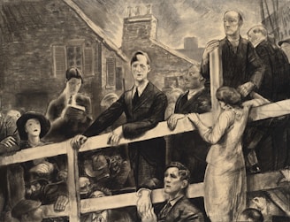 A group of people gathered closely together, with somber expressions, possibly attending a public speech or announcement. The setting appears to be a street scene with old buildings in the background. The figures are dressed in early 20th-century clothing, and there is a mix of attentive and concerned expressions.