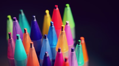 multi colored pen lot on black background