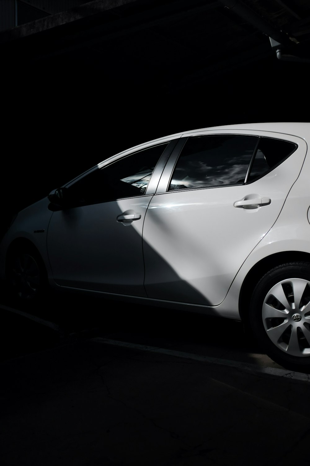 white 5 door hatchback in black background