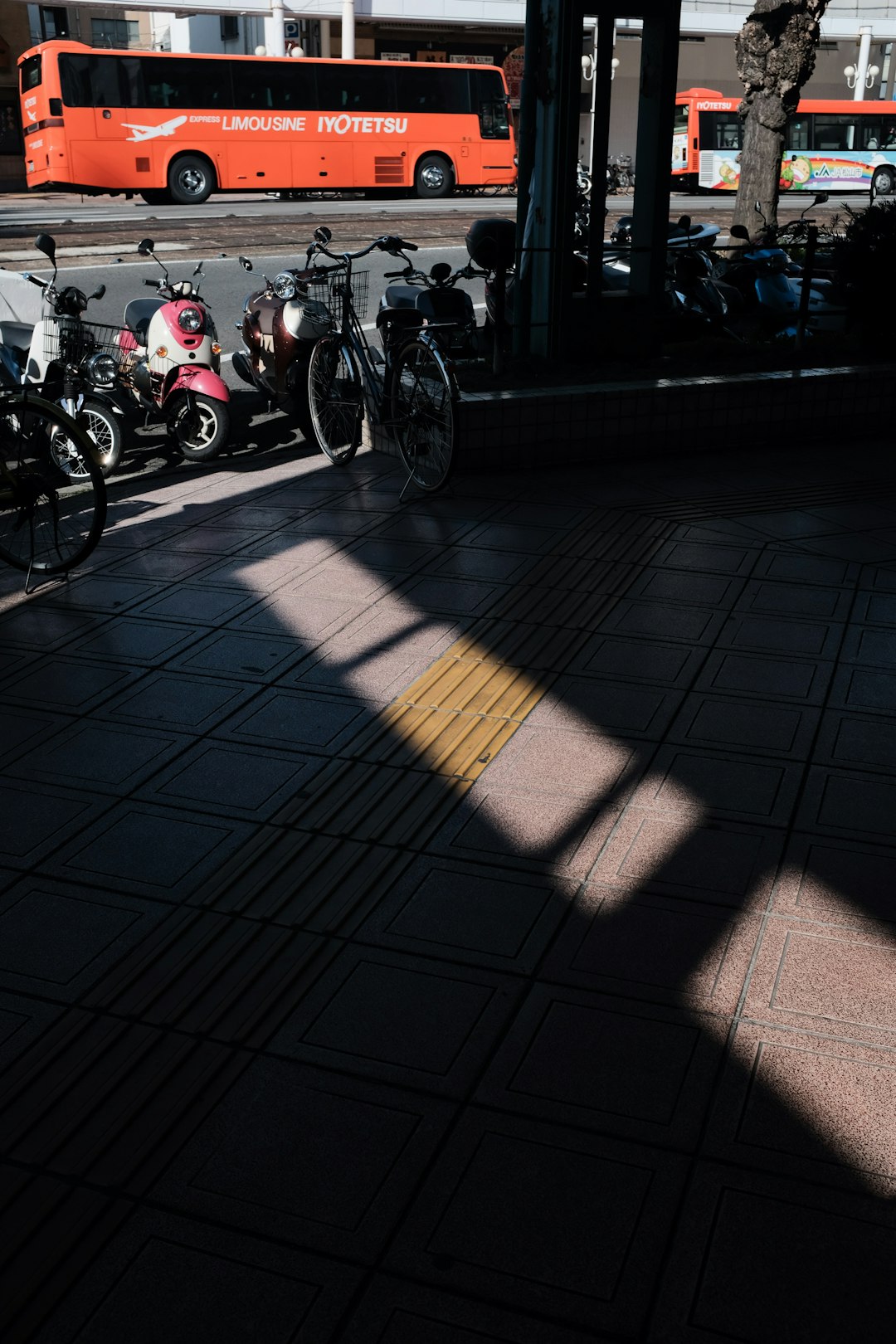 people riding motorcycle on gray concrete pavement during daytime