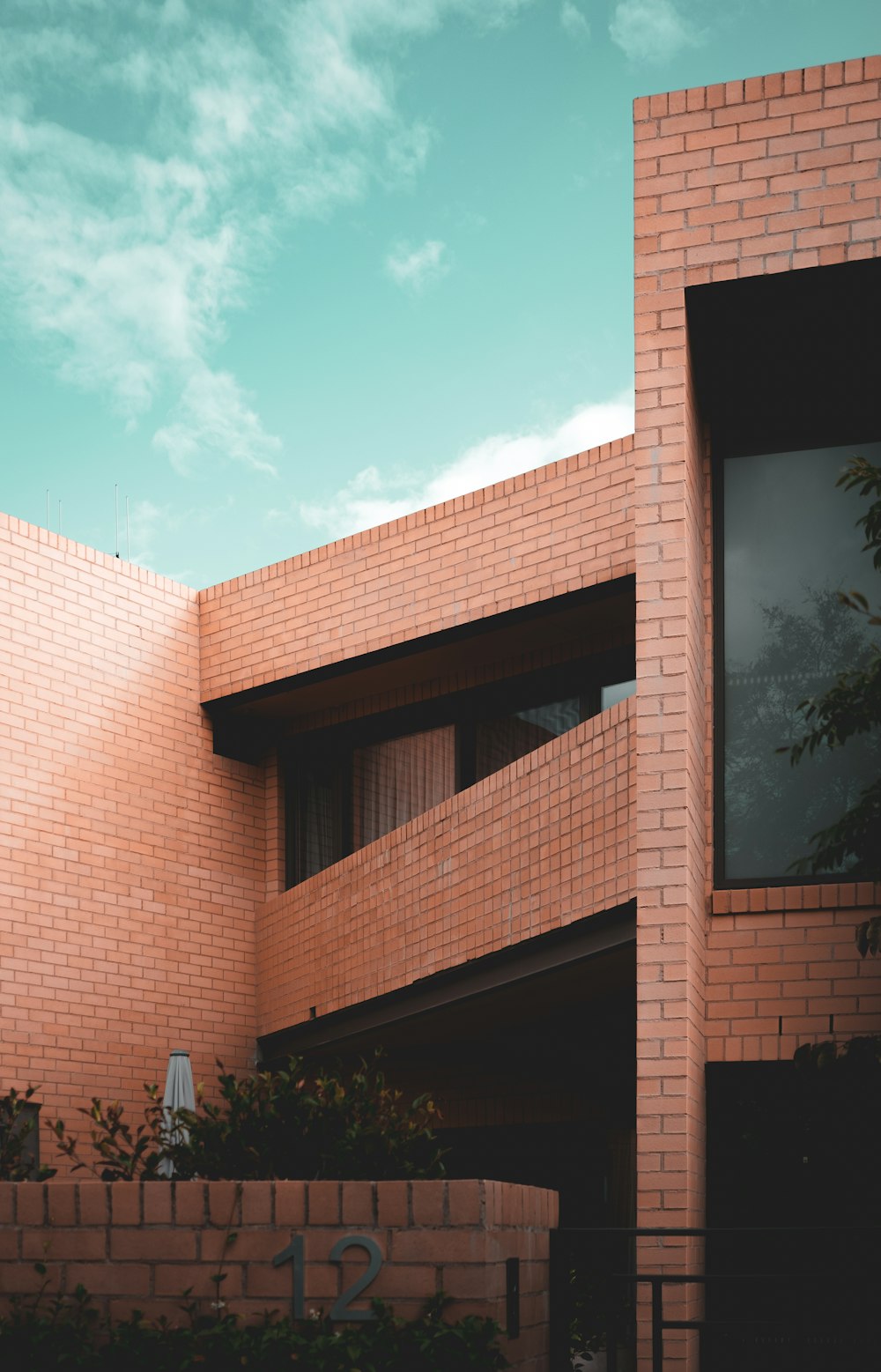 brown brick building under blue sky during daytime