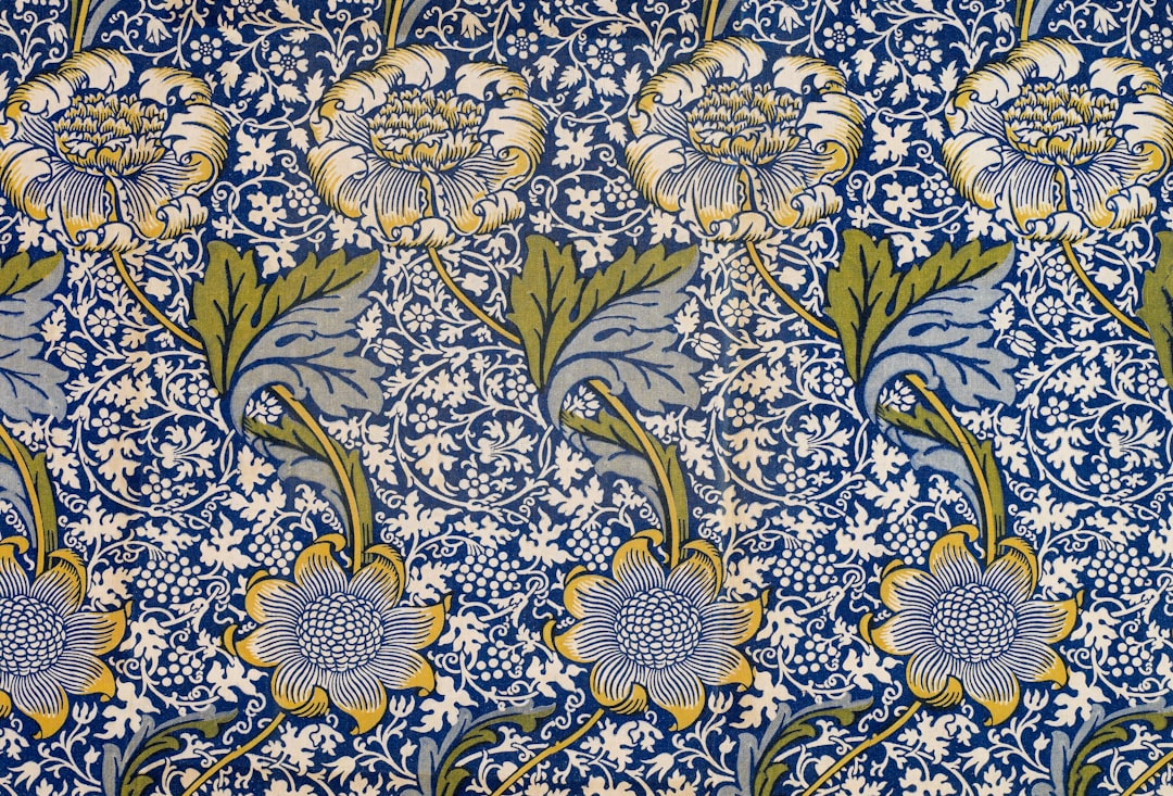 white blue and green floral textile