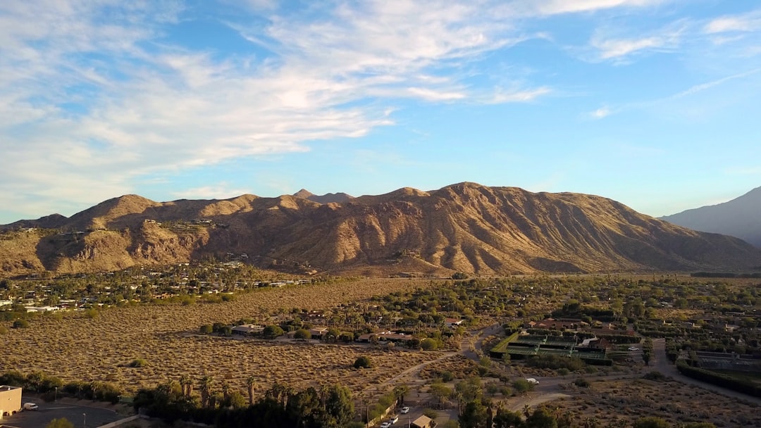 green and brown mountains under blue sky during daytime