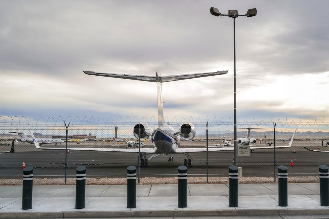 white airplane on airport during daytime