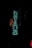 Bright neon sign with the word 'havana' in turquoise and an outline of a seated woman in red. The sign is against a dark background, making the colors pop vividly.