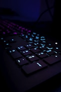 black computer keyboard on blue textile