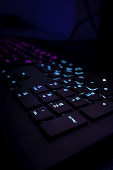 black computer keyboard on blue textile