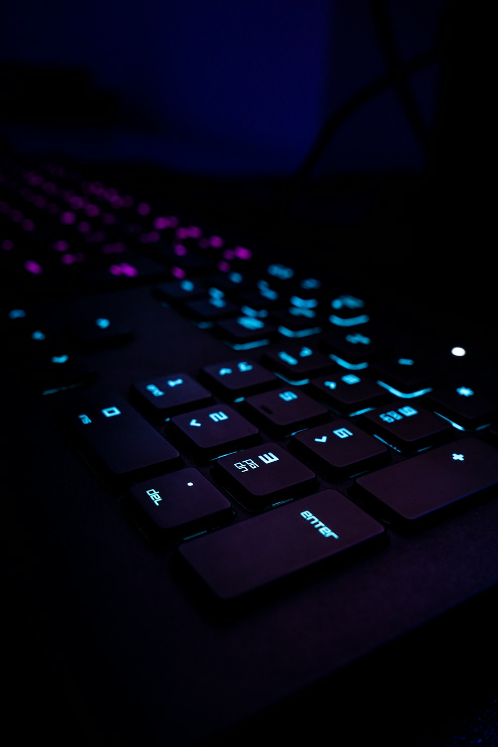 black computer keyboard on blue textile