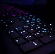 black computer keyboard on blue textile