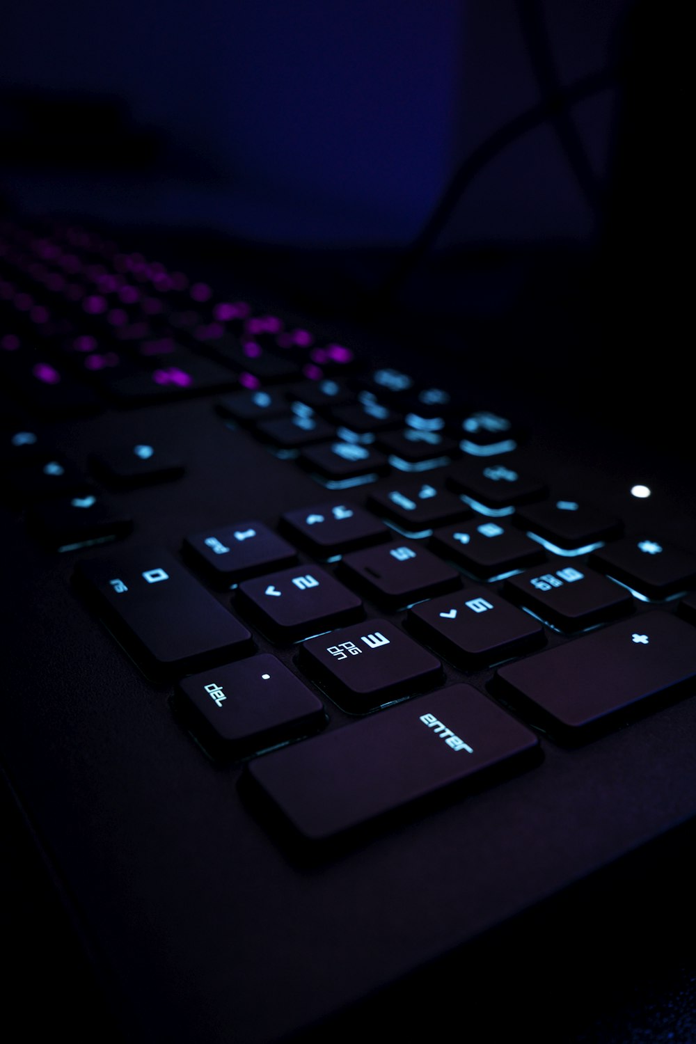 black computer keyboard on blue textile