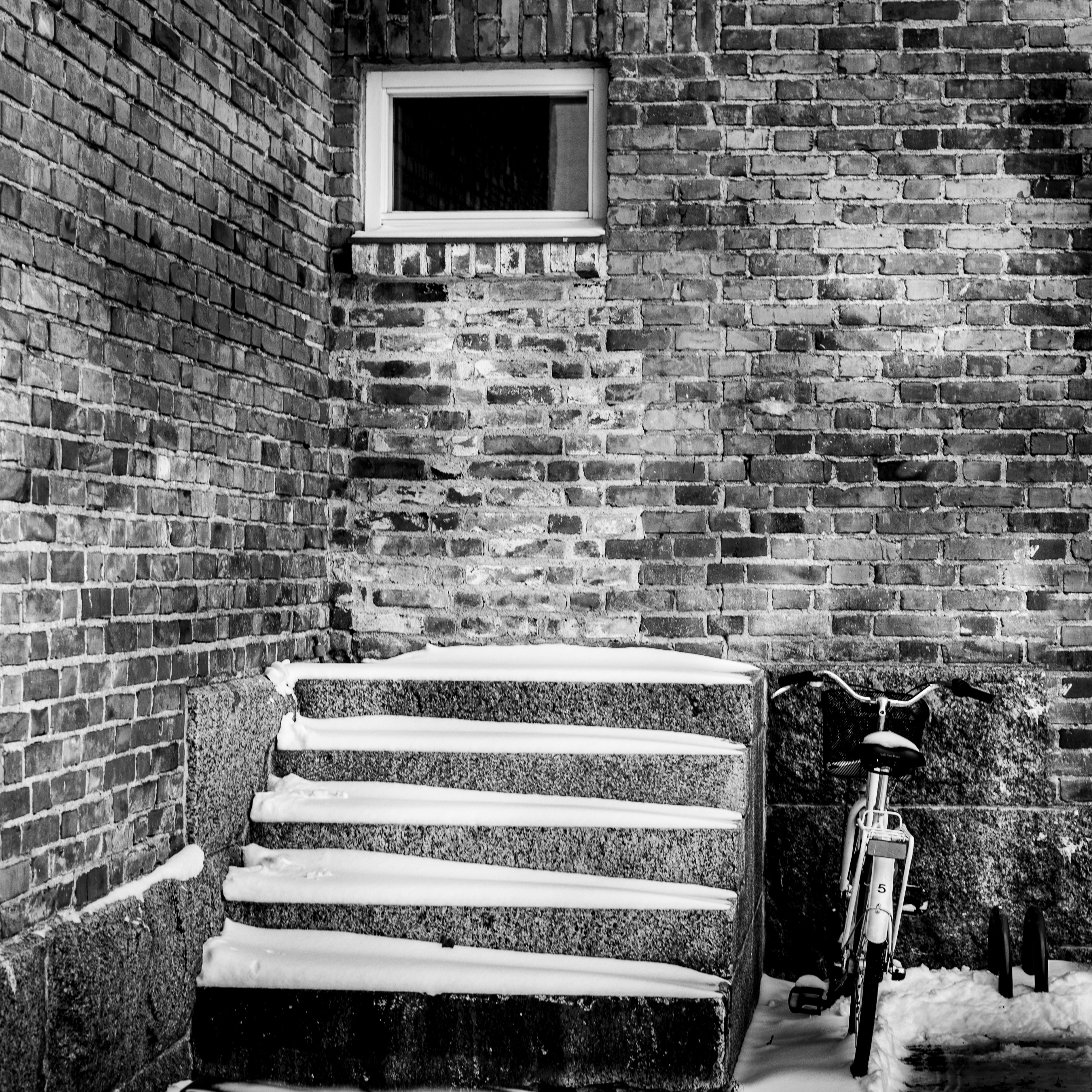 grayscale photo of a black and white chair