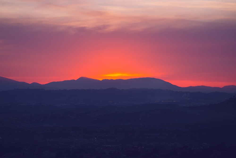 silhouette of mountains during sunset