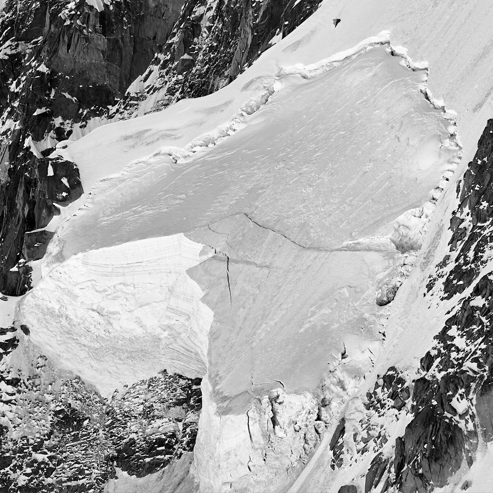 grayscale photo of snow covered mountain