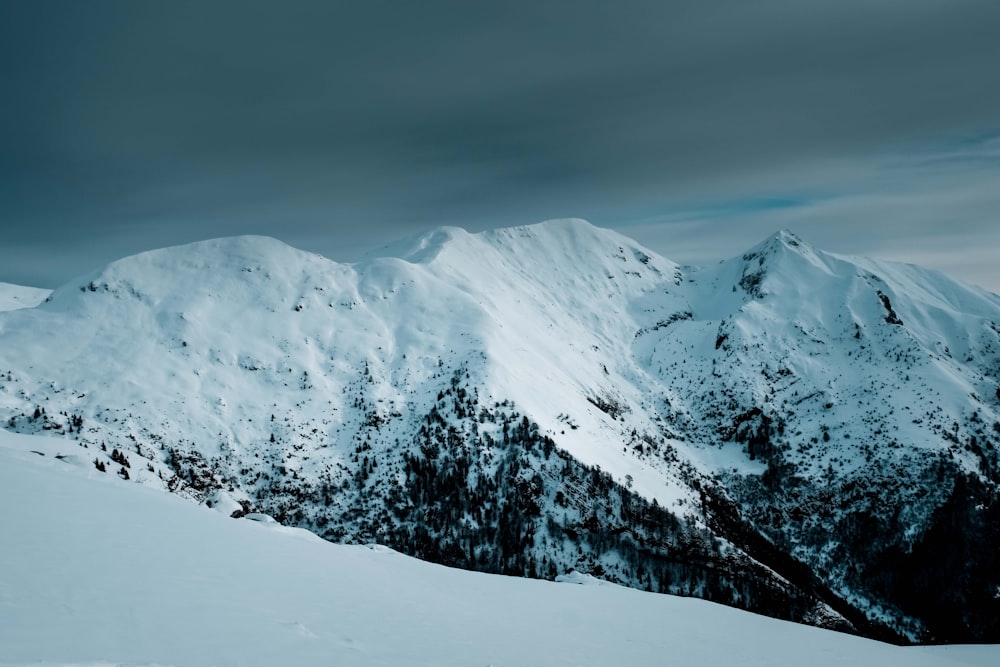 snow covered mountain during daytime