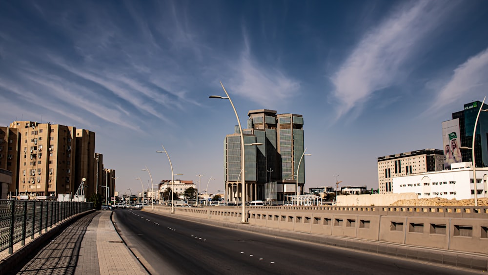 cars on road near buildings during daytime