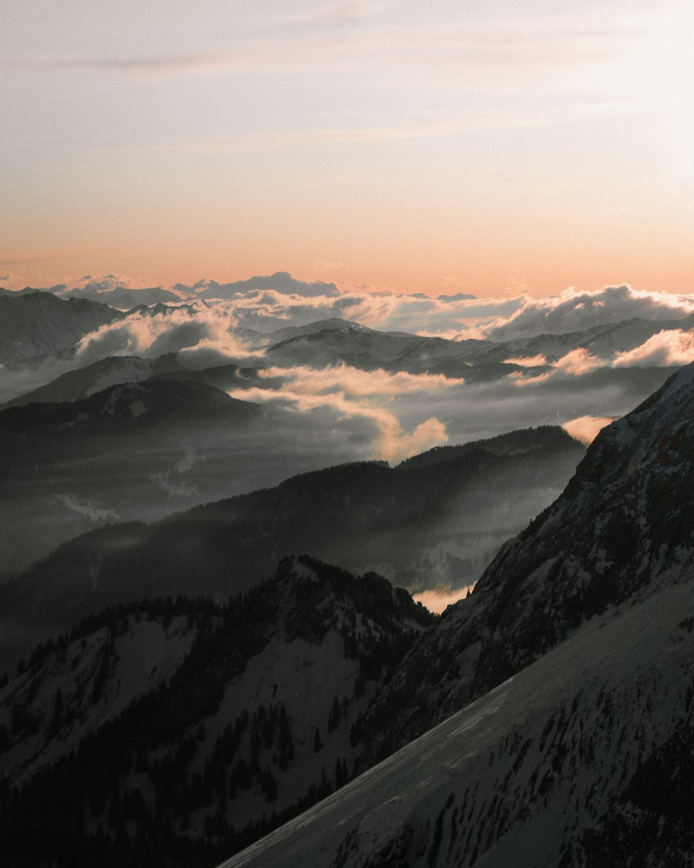 black and white mountains under white clouds during daytime