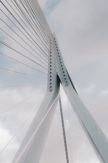 white bridge under white clouds