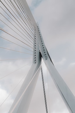 white bridge under white clouds