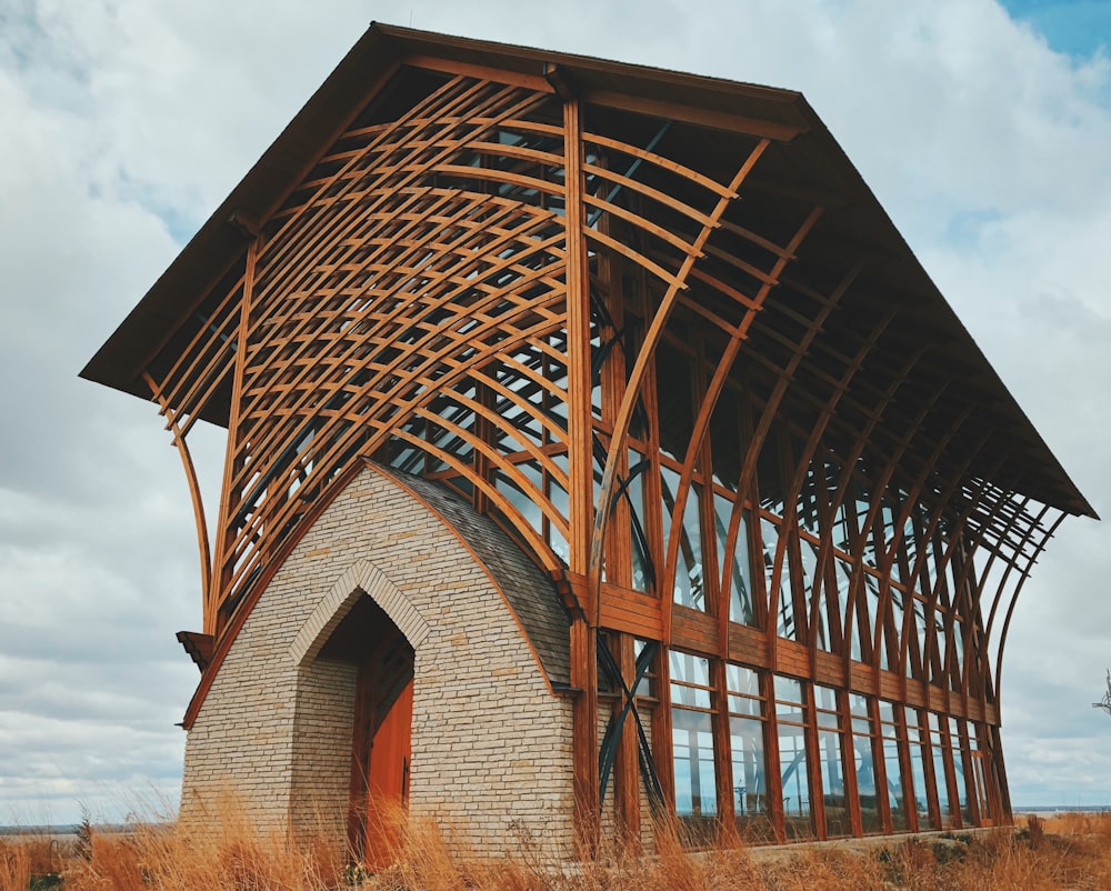 brown wooden building under white clouds during daytime