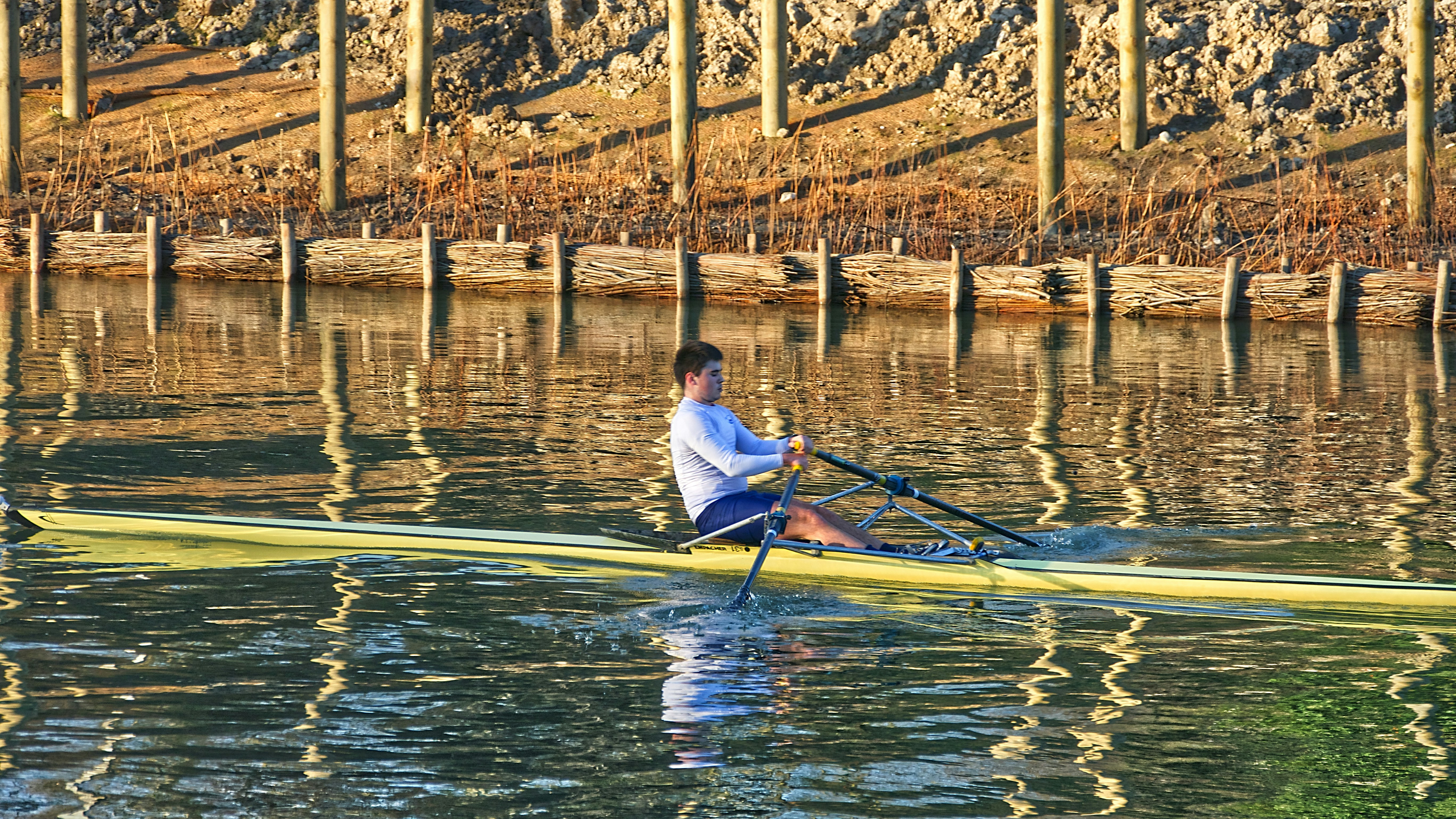 man in white shirt riding yellow kayak on river during daytime