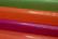Close-up of a package with seven colorful gel units arranged neatly.