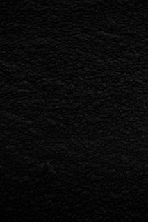 black textile in close up photography