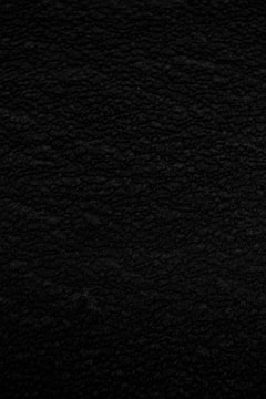 Close-up of a black velvet fabric with a luxurious texture.