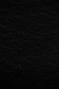 black textile in close up photography