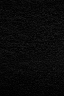 black textile in close up photography