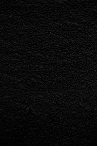 black textile in close up photography