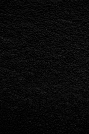 black textile in close up photography