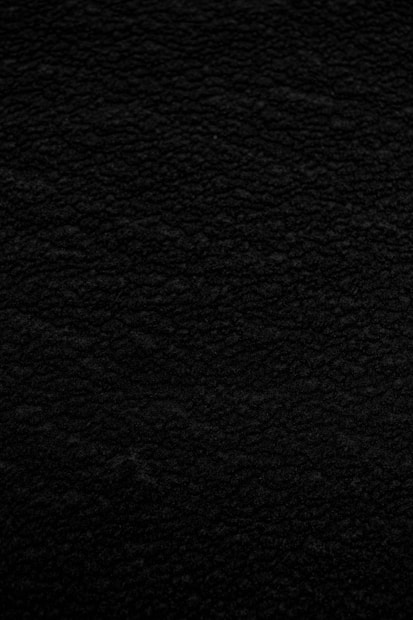black textile in close up photography