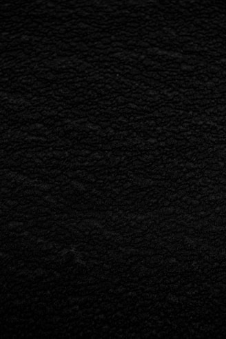 black textile in close up photography