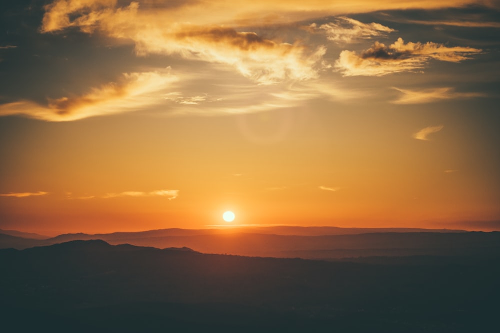 silhouette of mountain during sunset