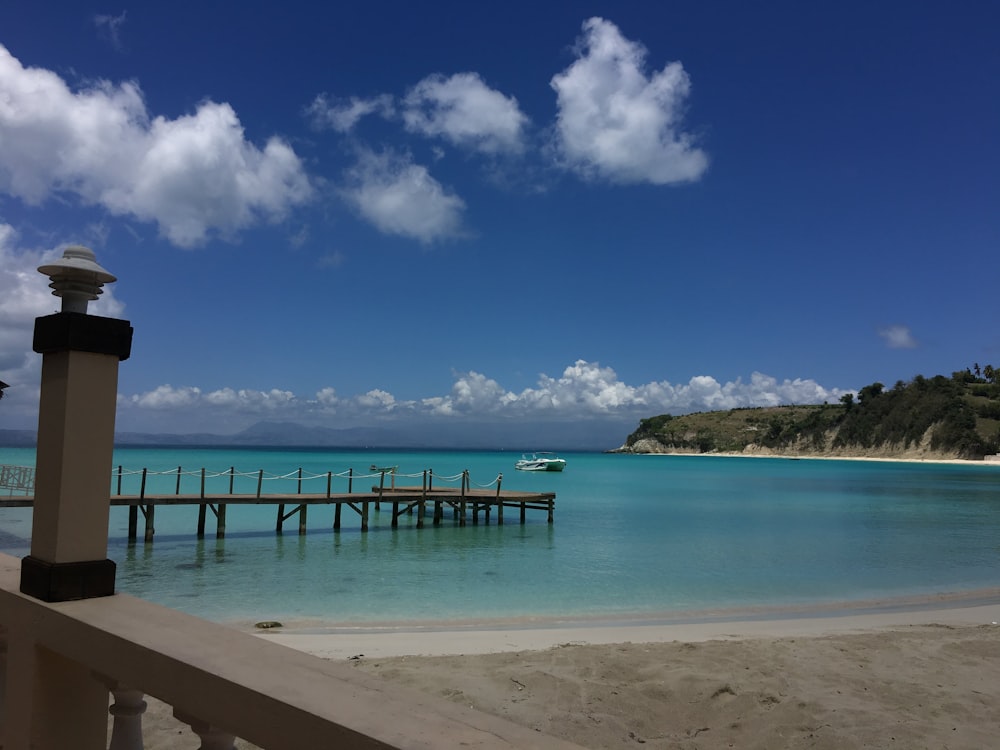 blue beach umbrellas on beach during daytime