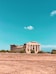 brown concrete building under blue sky during daytime