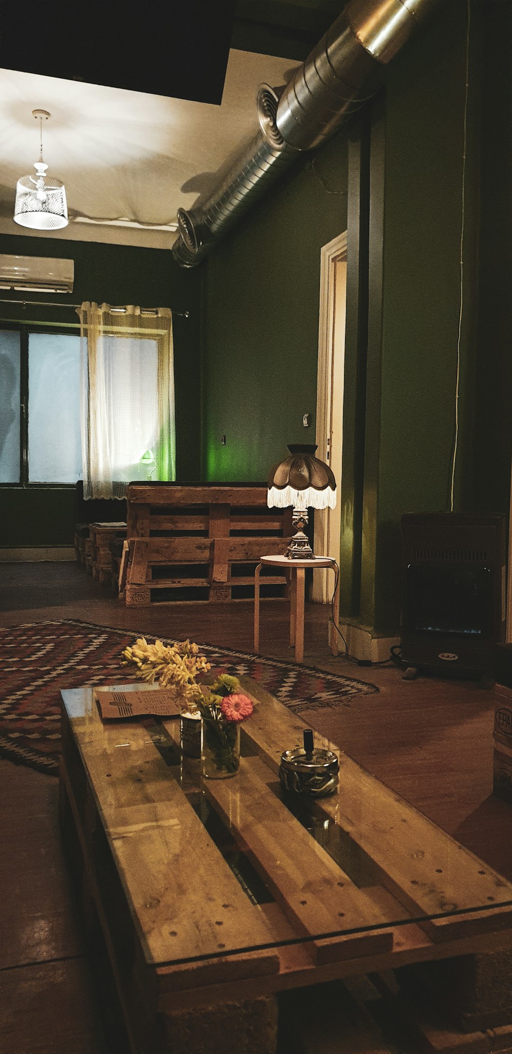 brown wooden table with flower on top