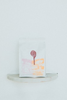 Packaging bags and hang tags with elegant branding designs.