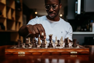 man in white crew neck t-shirt wearing black framed eyeglasses