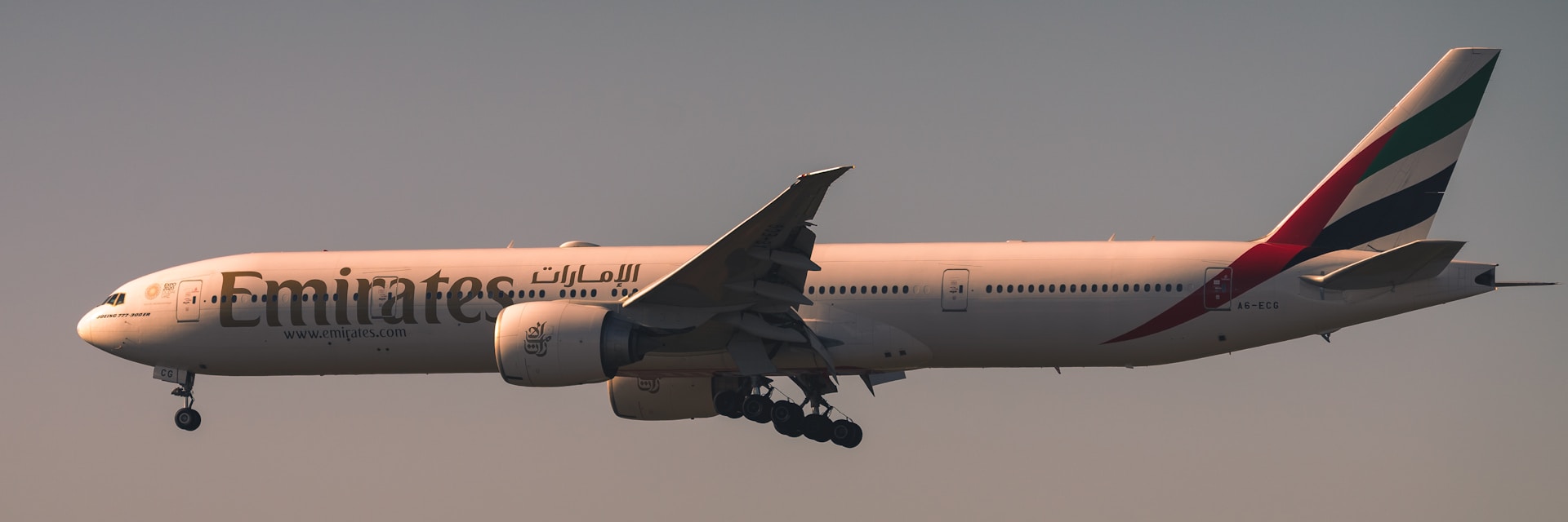 white passenger plane in mid air during daytime