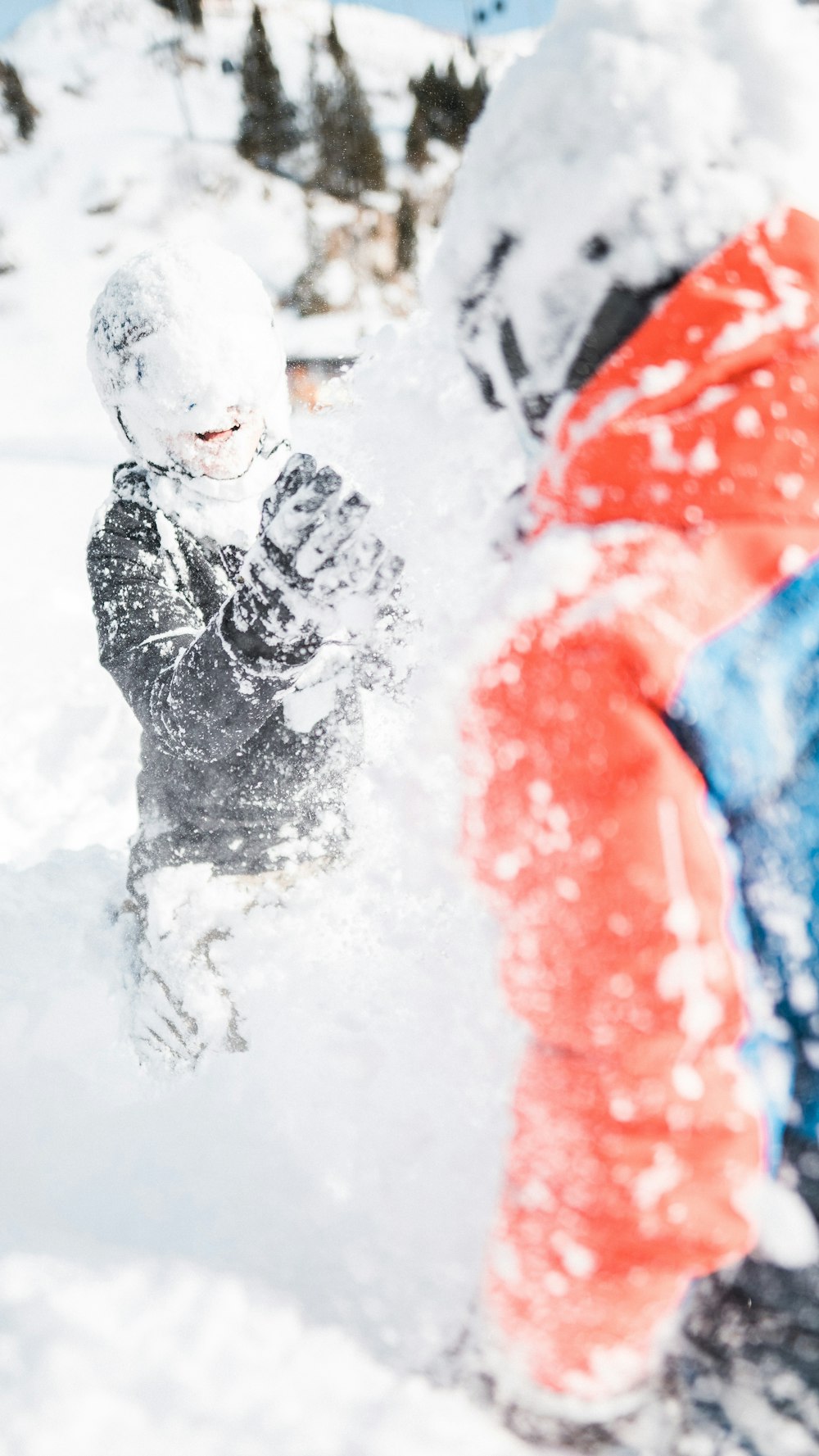 man in black jacket covered with snow