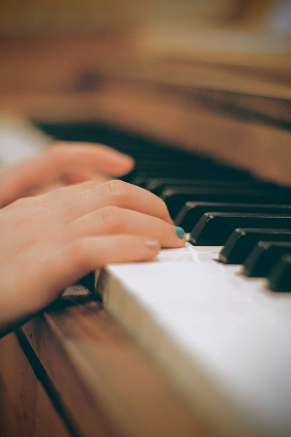 person playing piano in close up photography